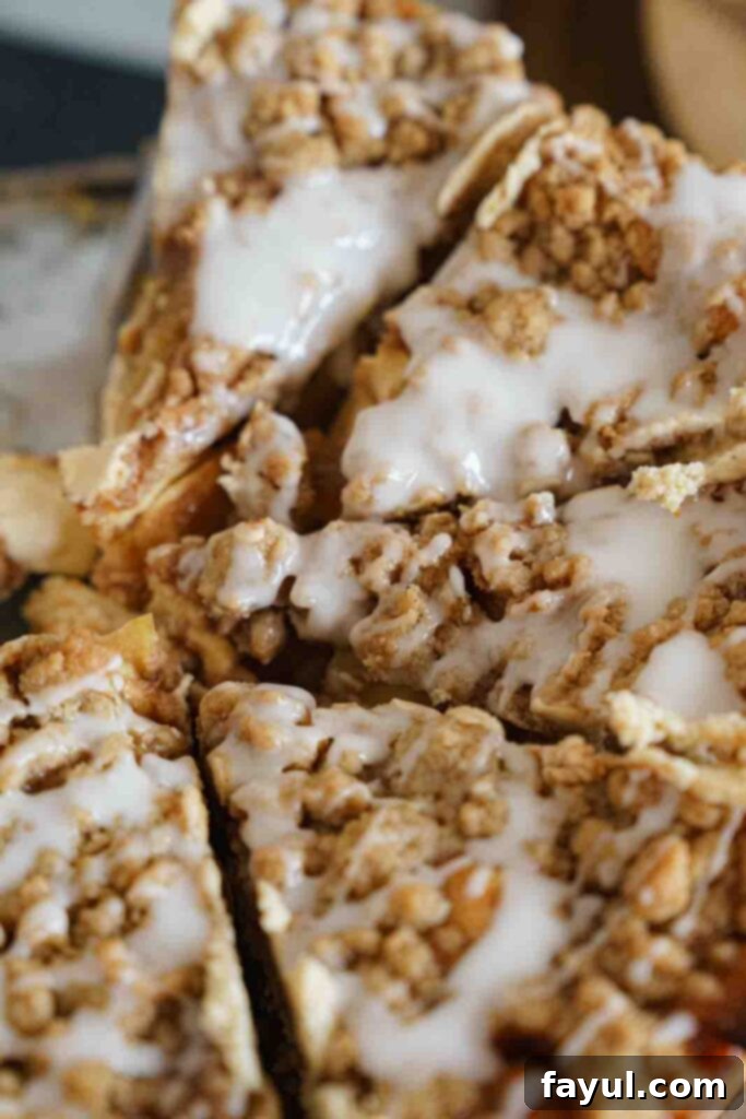 A close-up view of the golden streusel topping on the Apple Crisp Cheesecake, showing its crumbly texture.