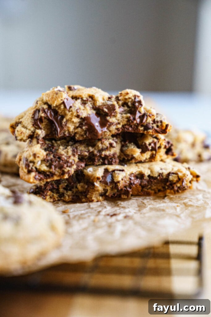 Close-up of a stack of golden brown butter chocolate chip cookies