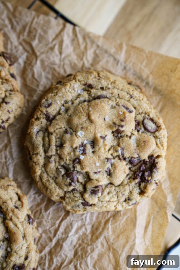 A tray of freshly baked brown butter chocolate chip cookies cooling