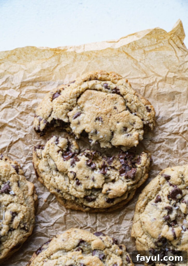 Freshly baked brown butter chocolate chip cookies on a cooling rack