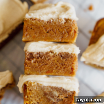 Pumpkin Cinnamon Roll Blondies with creamy frosting