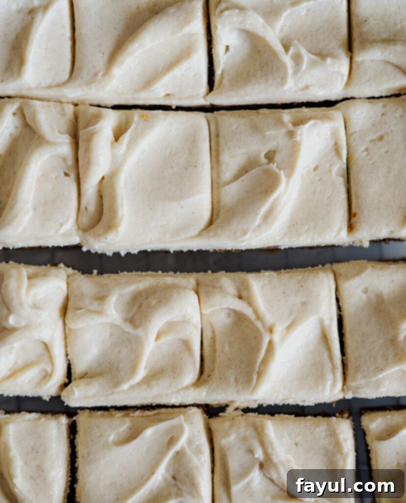 Close-up of freshly baked Pumpkin Cinnamon Roll Blondies showing the cinnamon swirl