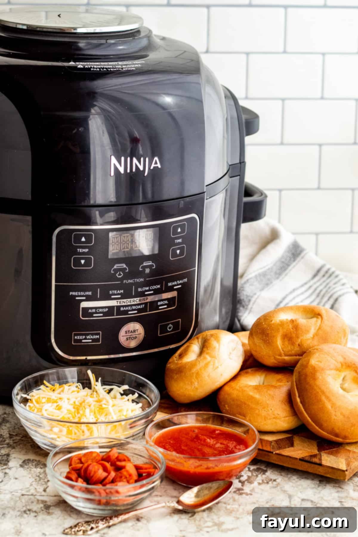 The Best Homemade Air Fryer Bagel Bites 3 Ingredients for recipe laid out on table with air fryer.