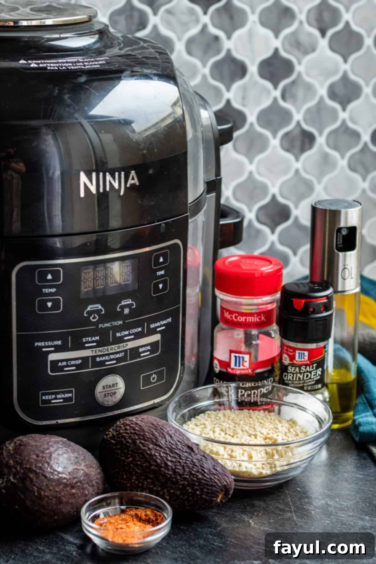 Speedy and Simple Air Fryer Avocados 3 Ingredients laid out on dark counter with air fryer,