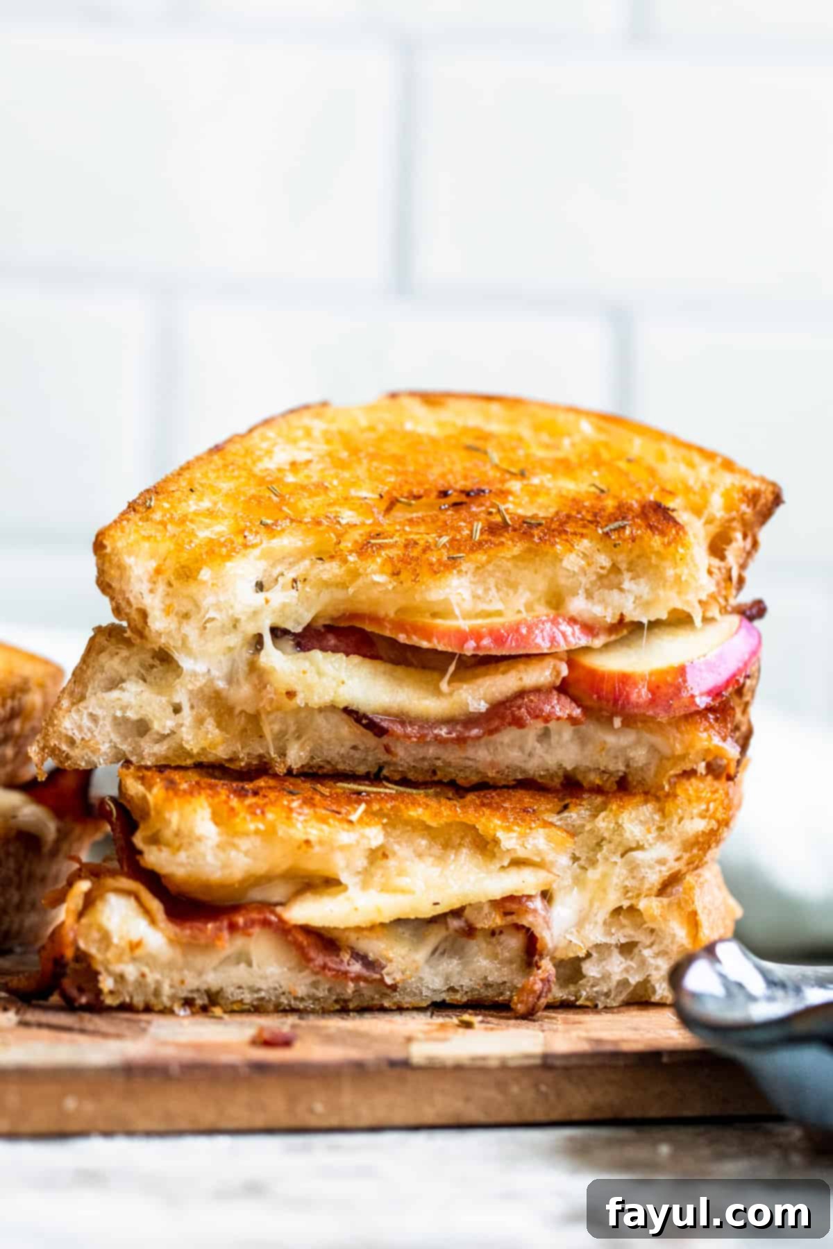 Strait on shot of apple grilled cheese stacked on top of each other.