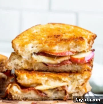 Strait on shot of stack of bacon and apple sandwiches.