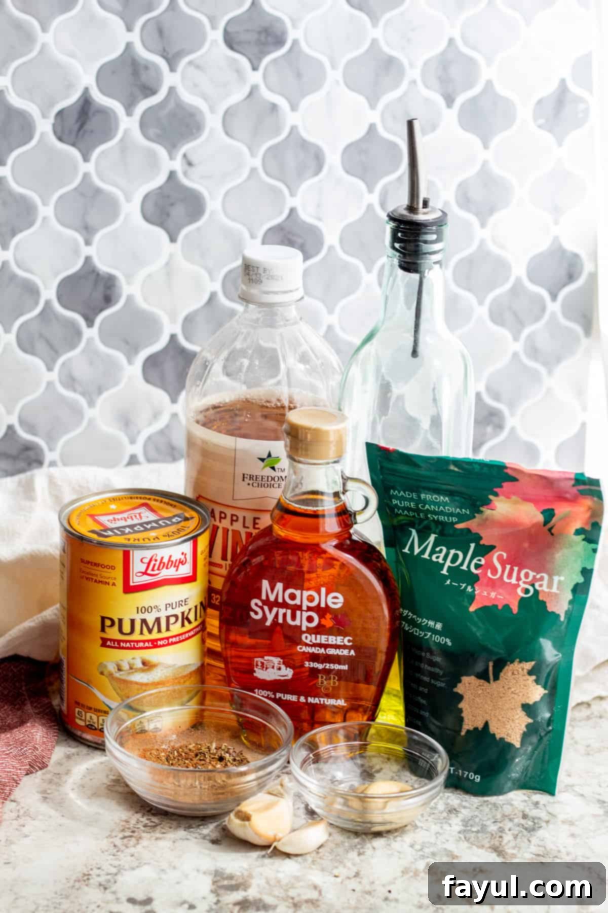 Ingredients laid out on white table in glass bowls and packaging.
