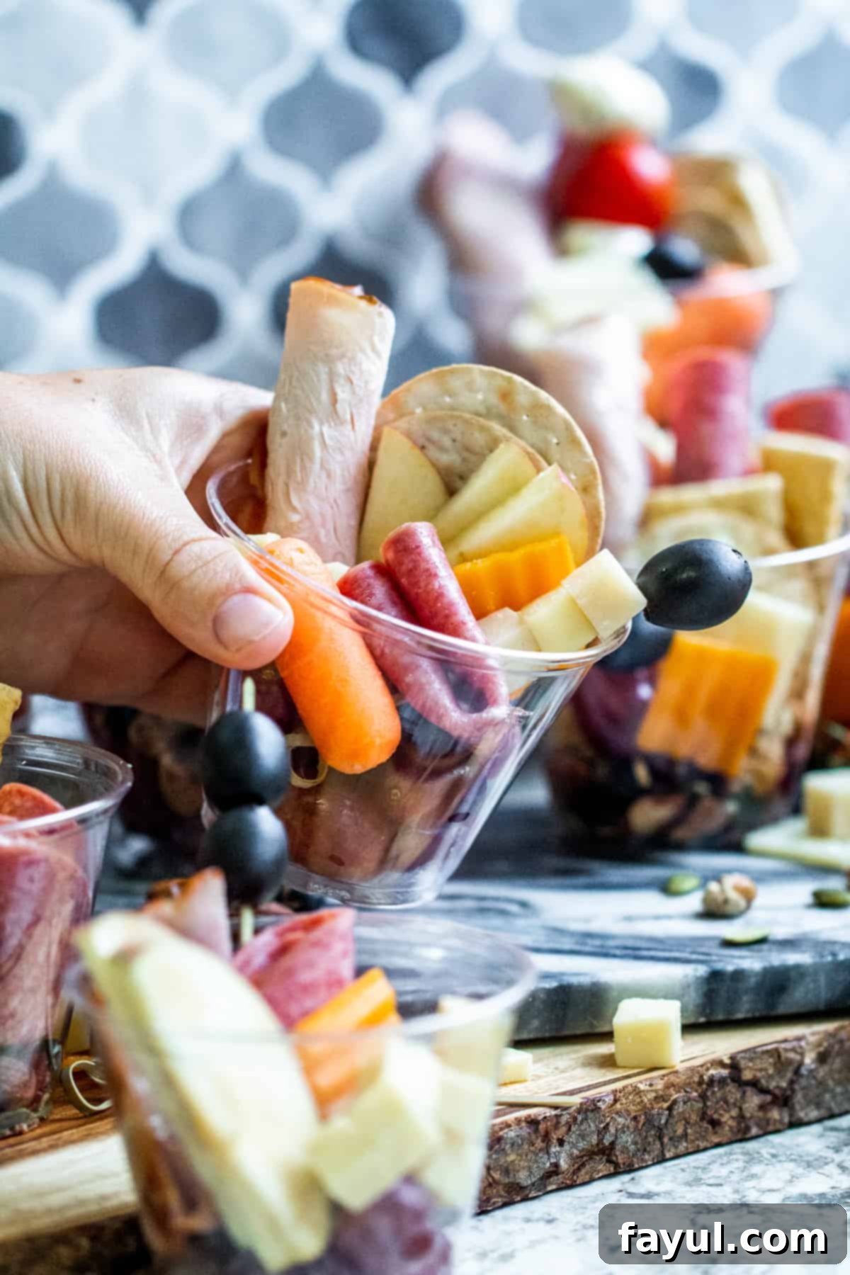 Hand picking up plastic cup.