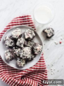 Delicious Chocolate Peppermint Cake Cookies on a marble counter with a glass of milk and a red holiday towel.