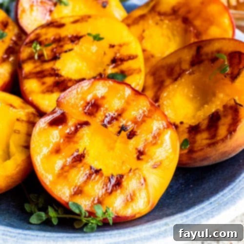 Close up shot of grilled peach on plate.