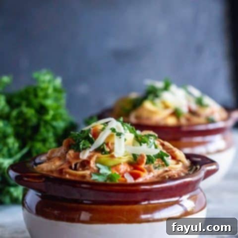 Hearty one-pot creamy chicken tomato tortellini soup, an easy and comforting meal.