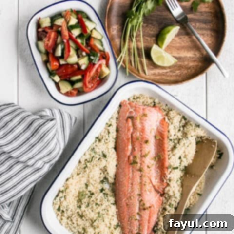 Flaky broiled salmon served with a fresh herbed couscous salad, a gourmet yet quick 15-minute dinner.