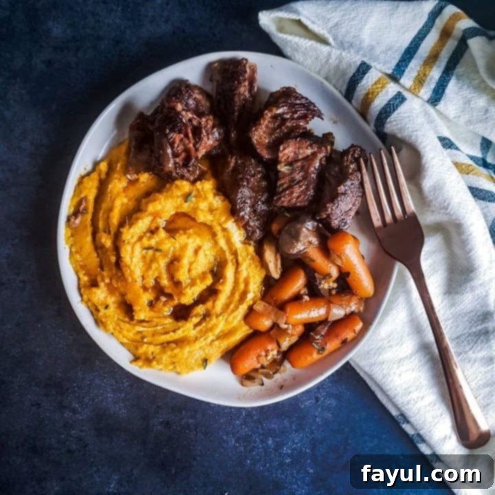 Succulent crockpot beef short ribs, falling off the bone tender and coated in a rich, savory sauce.