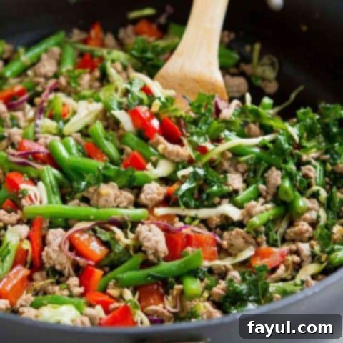 A healthy and flavorful ground turkey stir-fry with green beans and kale, a quick 20-minute meal.