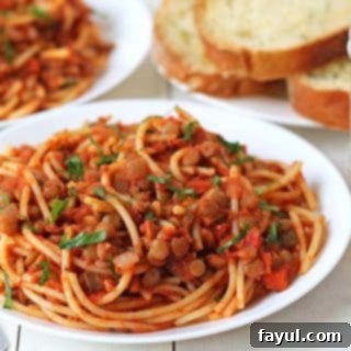 Rich and savory vegan lentil bolognese sauce served over pasta, a quick and satisfying Italian-inspired meal.