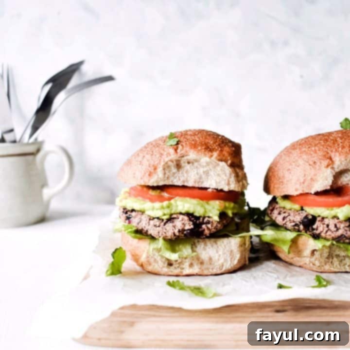 Flavorful and healthy vegan black bean burgers on buns with fresh toppings, a great alternative to traditional burgers.