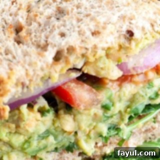 A fresh and vibrant chickpea avocado sandwich filled with plant-based goodness, perfect for a quick and light meal.
