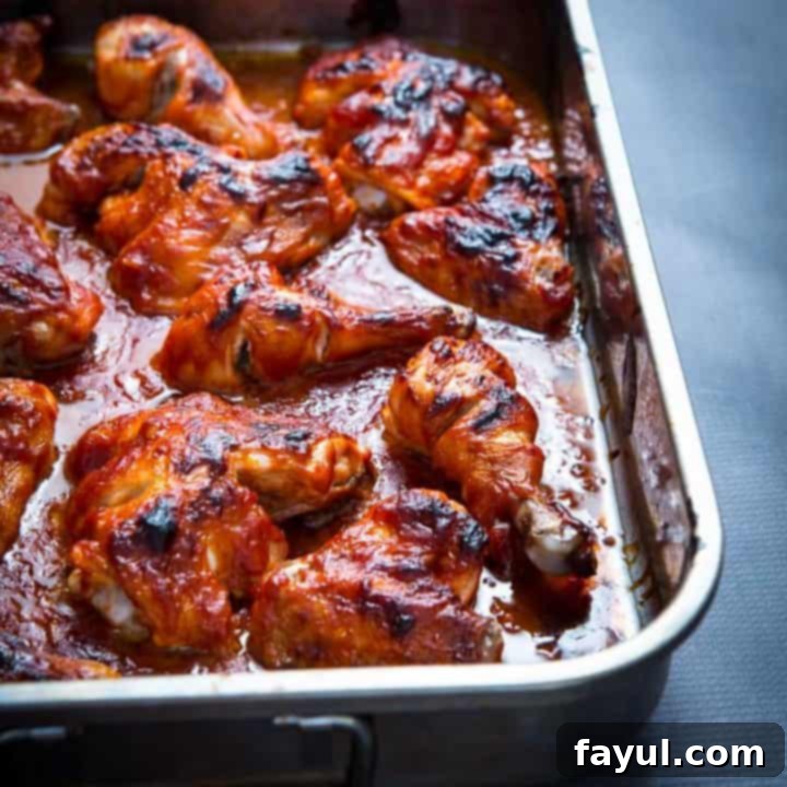 Perfectly baked barbecue chicken, featuring a sticky, sweet, and smoky glaze, ideal for a crowd-pleasing family meal.