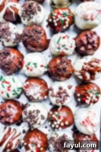 Oreo truffles on parchment paper in four lines.