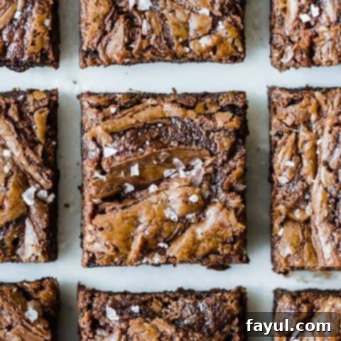 The best Nutella brownies, featuring a rich, fudgy texture packed with Nutella and melting chocolate chips, promising complete satisfaction.