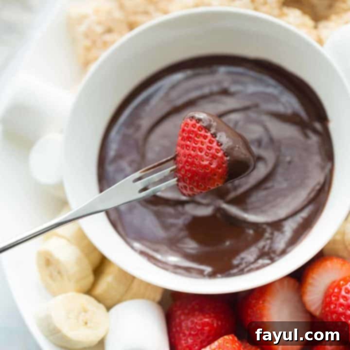 Rich and decadent chocolate fondue, with various dipping items like fruit and marshmallows, presented beautifully for a shared romantic experience.