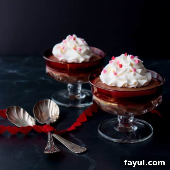 Silky smooth three-ingredient chocolate mousse served in elegant glasses, garnished with chocolate shavings and a hint of mint, highlighting its luxurious texture.