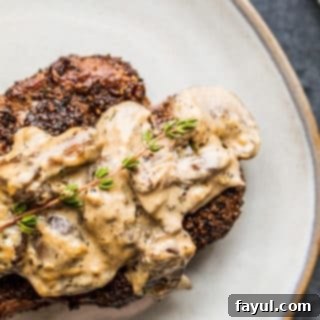 Overhead shot of steak on gray plate.