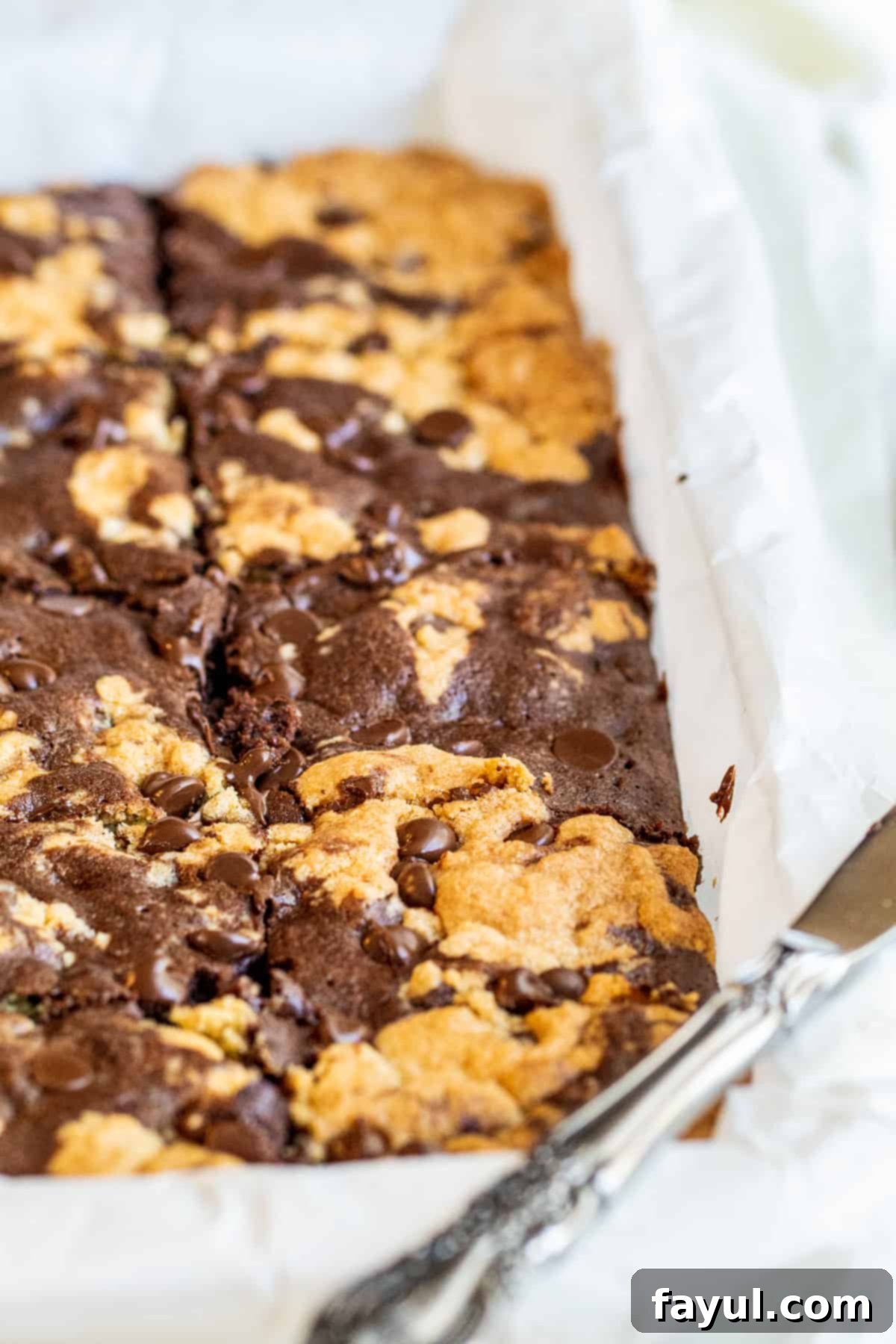 Decadent Chocolate Chip Cookie Brownie Bars 7 Angle shot of brownies in baking dish.
