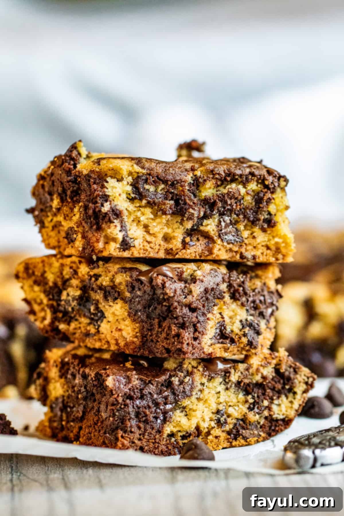 Decadent Chocolate Chip Cookie Brownie Bars 8 Brookie bars in stack.