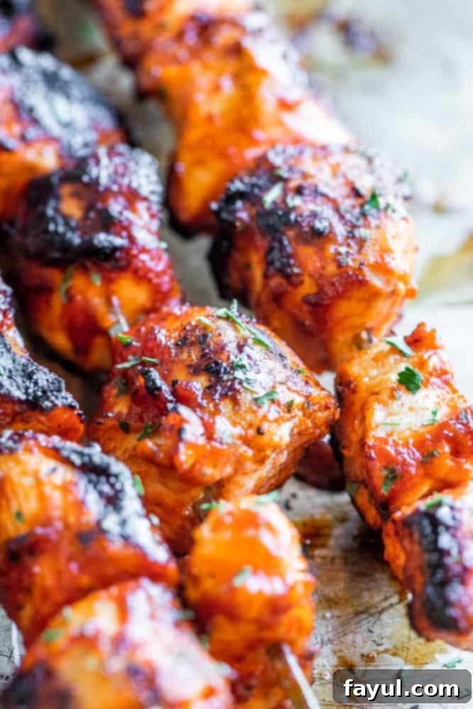 Chipotle Honey Glazed Chicken Skewers 3 Close up shot of honey chipotle chicken on kabobs, perfectly grilled.