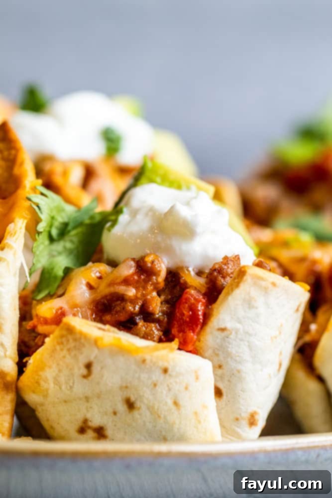 Strait on shot of taco cup on gray platter.