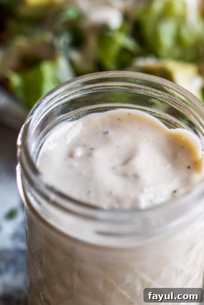 Angle shot of dressing in a glass mason jar.